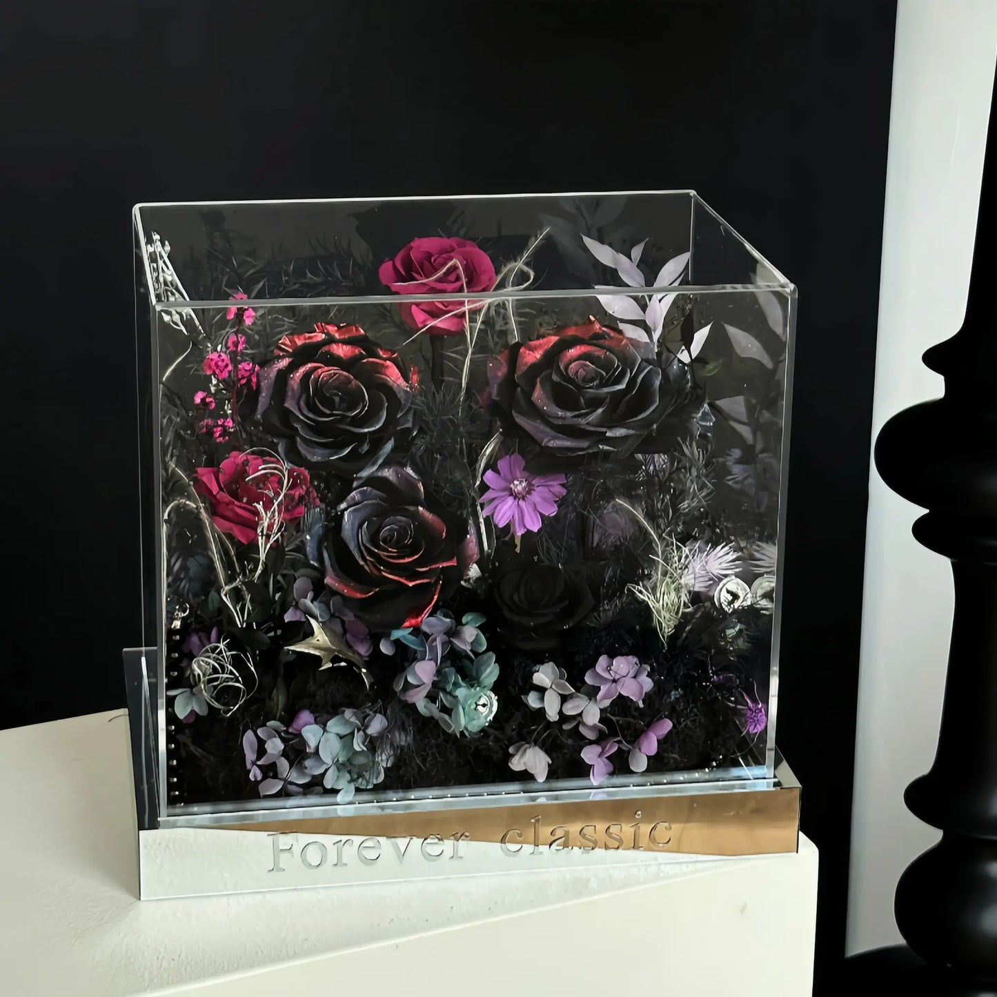 LULU ROSÉE nightfall red flame acrylic box in a dramatic mood setting