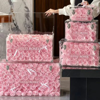 LULU ROSÉE Grande Eternal Acrylic Handbag Rose Box, luxury handbag-shaped transparent acrylic gift box filled with blush pink preserved roses, multi-size full set display, customizable flower colors, romantic everlasting floral souvenir for anniversary & birthday gifting