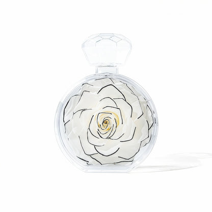 LULU ROSÉE single rose perfume bottle black trimmed white rose on white background